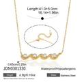 Detail view of gold wave necklace with zircons showing dimensions and stainless steel material - Gold Wave (JDN0301330) / Gold