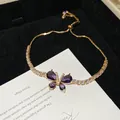 Detailed view of vintage purple butterfly bracelet with shimmering zircons and adjustable clasp - 13# Bracelet / Gold Purple