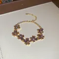 Elegant gold-tone bracelet with purple zircon flower petals and an adjustable chain - 34# Bracelet / Gold Purple
