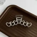 Pince à cheveux en métal argenté avec motif de cœurs liés et finition miroir polie - Cœur Lié Argent