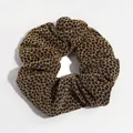 Elegant gold and black metallic leopard print hair scrunchie with shimmering fabric texture - Black & Gold