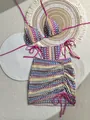 Flat lay of colorful crochet bikini and drawstring skirt with boho wave patterns - S / Top And Bottom / Rose Pink