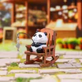 Cute panda figurine sitting on a miniature wooden rocking chair with a fishing rod - Fishing Panda Figure (1256-3)
