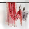 Red Chinese silk scarf featuring elegant calligraphy and traditional floral border pattern - Ink Wash Red