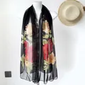 Long summer silk scarf for women featuring red floral lotus patterns on a black background - Ink Peony Black
