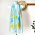 Light blue floral summer shawl with pink blossoms and green leaves for beach sun protection - Ink Peony Lake Blue