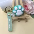 Détail du porte-clés patte de chat vert menthe avec lanière Lucky Day décorée - Vert
