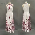 Voorkant en achterkant van een halter maxi-jurk met luipaardprint en bloemmotieven - S / Wit