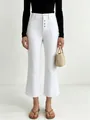 White high-waisted wide-leg denim pants featuring a vintage button-fly front design. - S / White