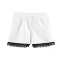 White high-waisted shorts with elegant black floral lace trim and pleated front details - White Shorts