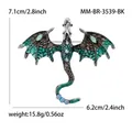 Detail of dragon brooch with green enamel wings and dimensions 7.1cm by 6.2cm - Antique Silver - Blue-black 3539-bk