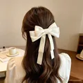 Elegant cream white oversized bow hair clip with long ribbons worn by woman - 18cm Large Single Bow (3021) / White