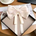 Champagne satin hair bow clip with rhinestones and butterfly charm on display card - Chain Rhinestone Bow / Beige
