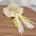 Khaki straw sun hat featuring a large white mesh bow and yellow floral accents - Appliqué Wind Chime Beige Yellow
