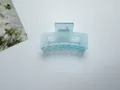 Large matte light blue hair claw clip for women with rectangle handle and smooth finish - Blue