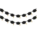 Macro shot of glittery black graduation cap banners with golden silk tassel details - Double Row Style / Black
