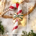 Weihnachts-Zuckerstange Anhänger mit rot-weißen Streifen und goldener Schleife - Zuckerstange