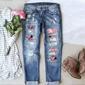Detail of ripped blue jeans with heart-shaped patches, pink sequins, and boho denim texture - 3XL