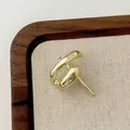 Elegant gold-tone irregular lava-style stud earrings with a polished metallic finish - Gold Irregular Hoop Earrings