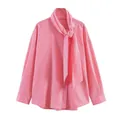 Detail of pink and white striped shirt featuring adjustable bow tie neckline and soft cotton - XS / Bright Pink Striped