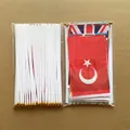 50pcs multi-country hand-held flags set with white plastic poles and gold tops - Basic Global Collection - Flat Pack / Standard Flag (With Matching Long Handheld Pole)