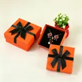 Orange square jewelry gift box with black bow ribbon and red rose earring set - 5x5x3cm (With Sponge) / Vibrant Orange (Gold Edge)