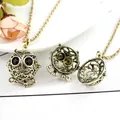 Vintage bronze owl locket necklace with hollow pattern and black gemstone eyes - Antique Bronze Black-Eyed Owl Pendant
