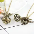Antique bronze locket necklace featuring hollow wing design and vintage style finish - Antique Bronze Carved Angel Pendant