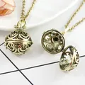 Antique gold spherical hollow locket necklace showing open and closed states - Antique Bronze Laughing Face Pendant
