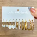 Golden 6-pair earring set featuring butterflies and pearls on a display card - Gold Butterfly And Pearl Hoop (WH0015-6)