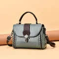 Retro moss green leather handbag with lychee texture and brown braided details - Green