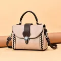 Beige faux leather handbag with brown woven details and adjustable shoulder strap - Khaki