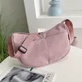 Pink corduroy crescent shoulder bag with adjustable strap and textured stripe finish - Pink