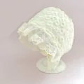 Macro detail of daisy embroidery and ruffled lace trim on baby sun hat - White Daisy Lace Trim Hat