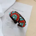 Detail of bohemian woven bracelet with red and turquoise beads on vintage card - 1-Woven Ethnic Style