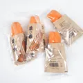 Squishy TPR toy shaped like deep-fried dough sticks in brown paper packaging - Fried Dough Stick