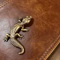 Detailed close-up of textured copper lizard scales and vintage metallic finish - Fat-Tailed Gecko