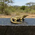 Macro shot of Komodo dragon figurine with detailed scales and vintage bronze finish - Komodo Dragon
