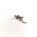 Detailed close-up showing the intricate scale texture of a vintage copper lizard ornament - Mini Lizard