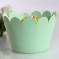 Elegant mint green laser-cut cupcake wrappers with scalloped petal edge design - Fruit Green