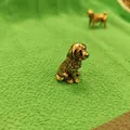 Antique style brass pug figurine with golden finish and vintage texture on green fabric - Golden Retriever