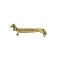 Detail of vintage brass dachshund dog figurine with brushed metal texture as desk decor - Extra Long Dachshund