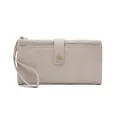 Detailed macro view of beige pebble grain leather texture and metallic snap buckle on clutch - Litchi Pattern Long Wallet / Beige