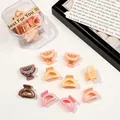 Close-up of colorful mini plastic hair claws and clear storage box in random macaron colors - Semi-circle / Milk Coffee