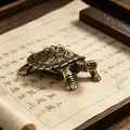 Close-up of handmade brass tortoise figurine with vintage texture on a scroll - Lucky Turtle
