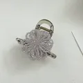 Detailed macro view of a translucent smoke gray hair claw with purple beaded flower - Light Purple