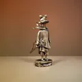 Detailed close-up of a vintage brass frog knight figurine with a rustic bronze finish - Brave Frog Warrior