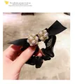Elegant black bow hair scrunchie with dual pearls and rhinestone embellishments - Black Pearl Scrunchie
