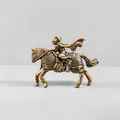 Macro detail of solid brass Monkey King figurine riding a horse on a sleek stand - Mulan