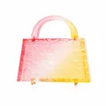 Detail of gradient pink to yellow acrylic handbag with ice-crack texture and gold feet - Pink